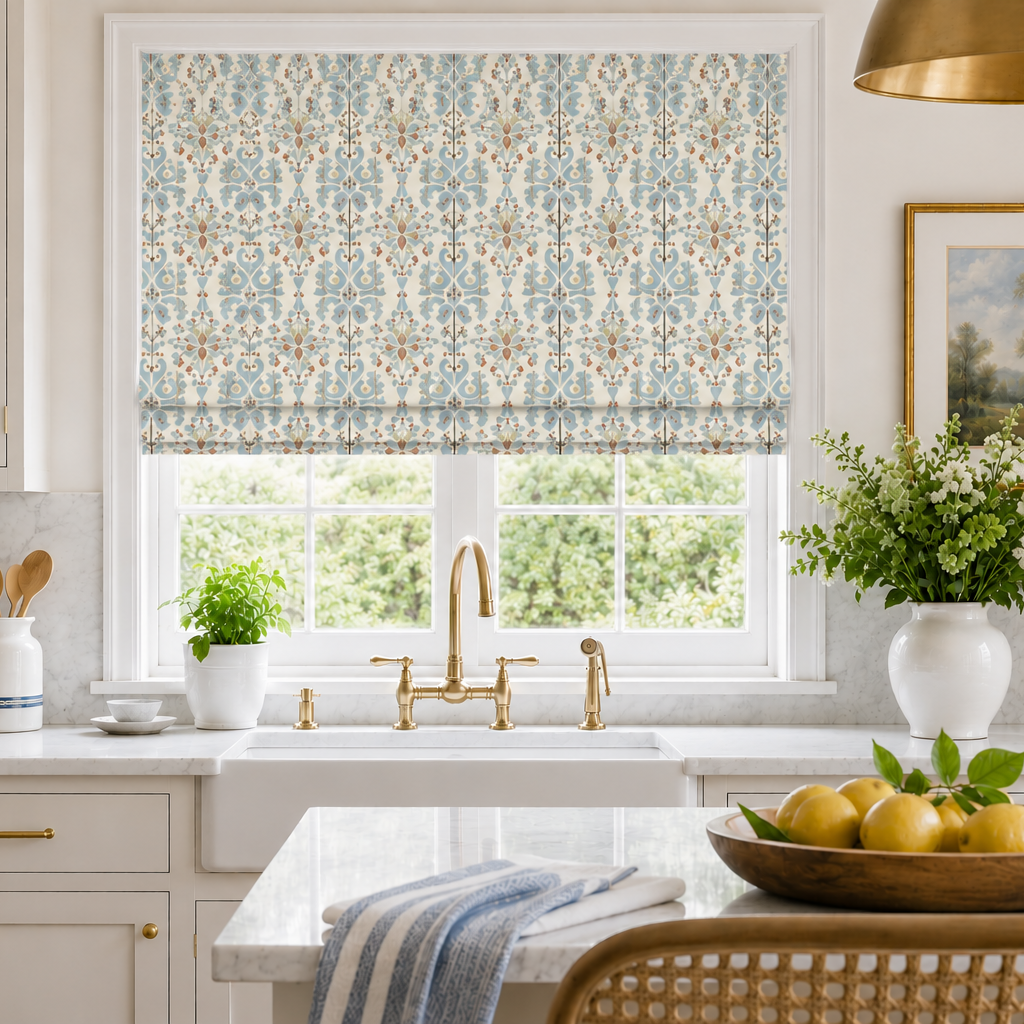 Modern kitchen with a patterned roman blind, sink, and decor elements.