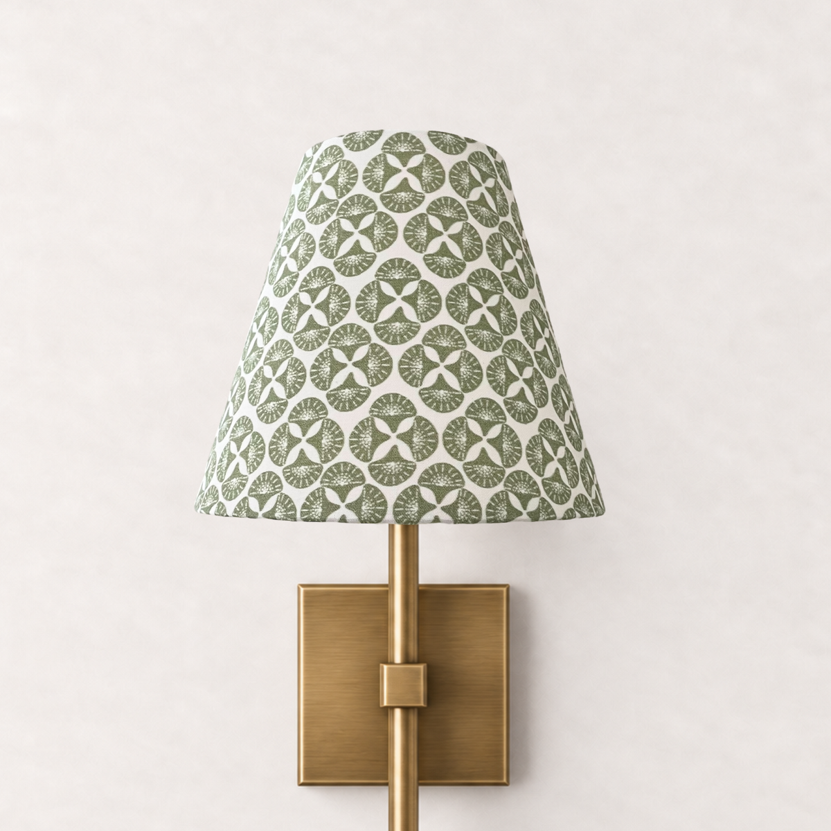 Sea Star Green patterned clip-on sconce lampshade on brass wall sconce by Noble Winter
